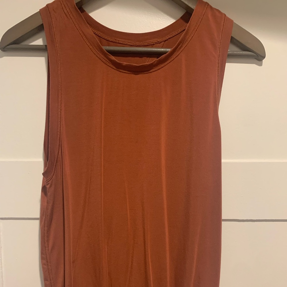 Lulu - cinch bottom tank. Open back. High neck line.